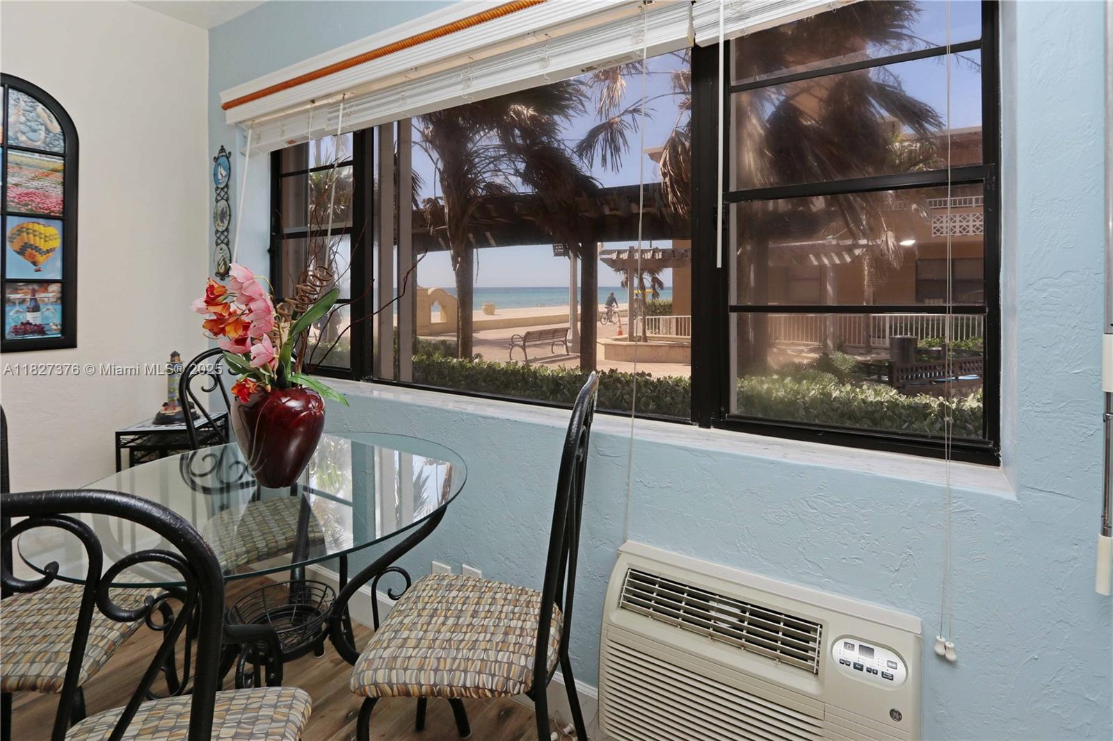 3300 North Surf Road, Unit 3A Hollywood, FL 33019 - Photo 4 of 39 a dining room with furniture and window