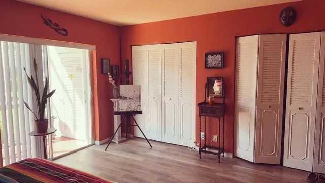 a view of a room that has a table and chairs