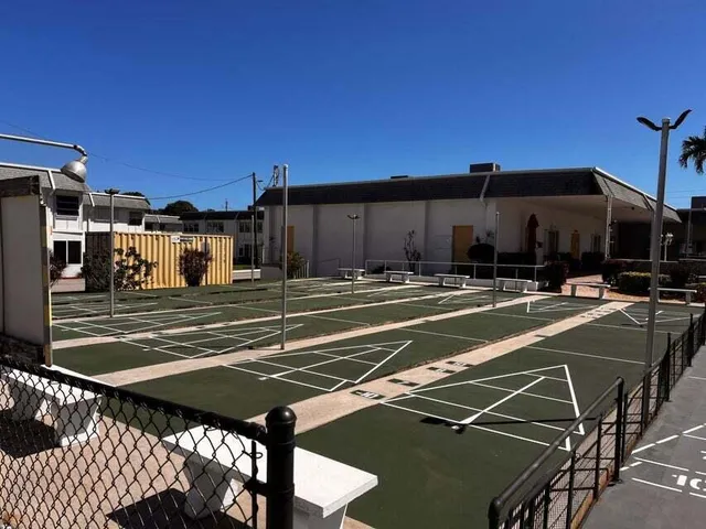 a view of swimming pool with outdoor seating and yard