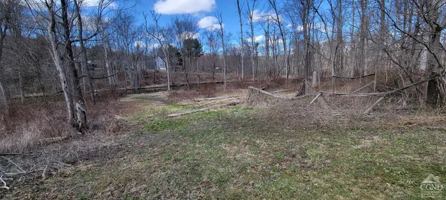 a bedroom with furniture and a chandelier