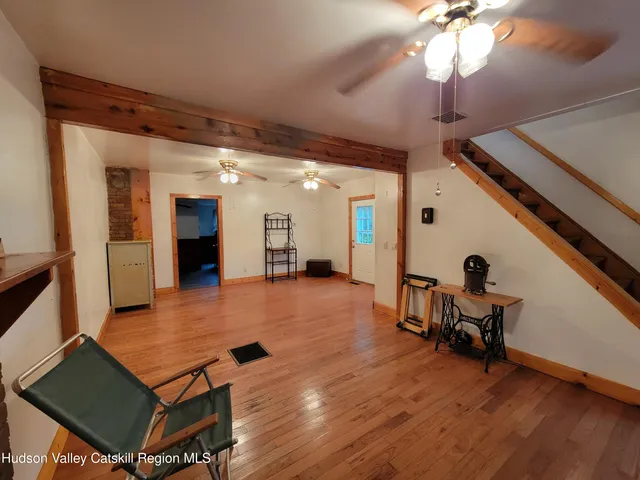 a room with furniture and a wooden floor