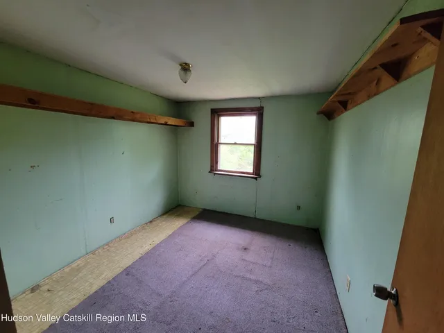 a view of a yard with large trees