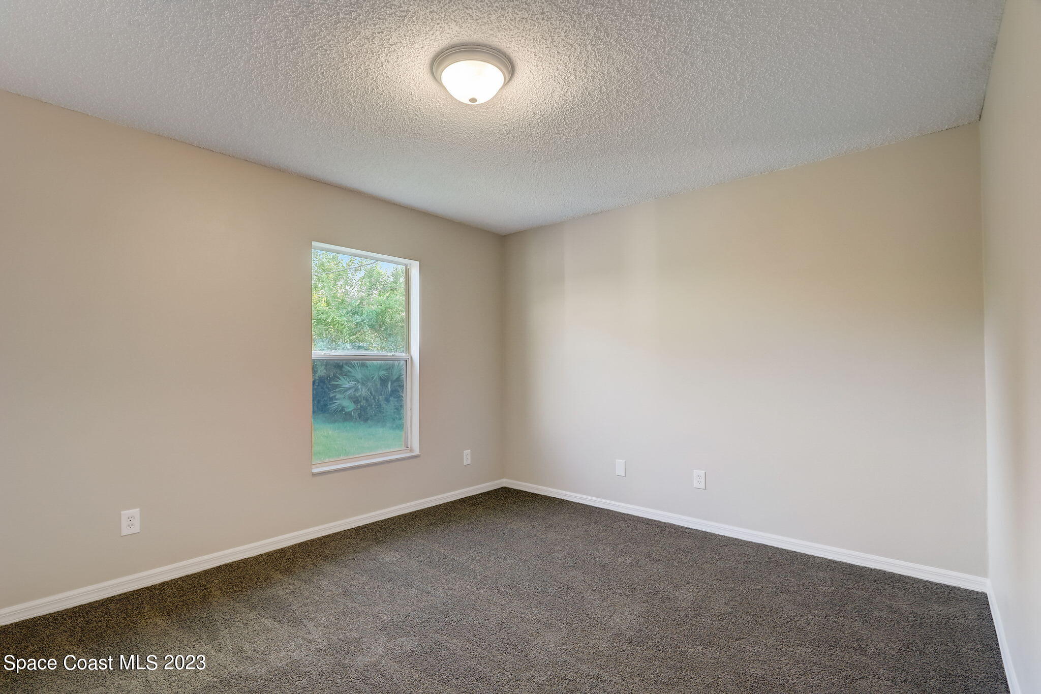 280 Gamewell Road Southwest Palm Bay, FL 32908 - Photo 12 of 19 an empty room with a window