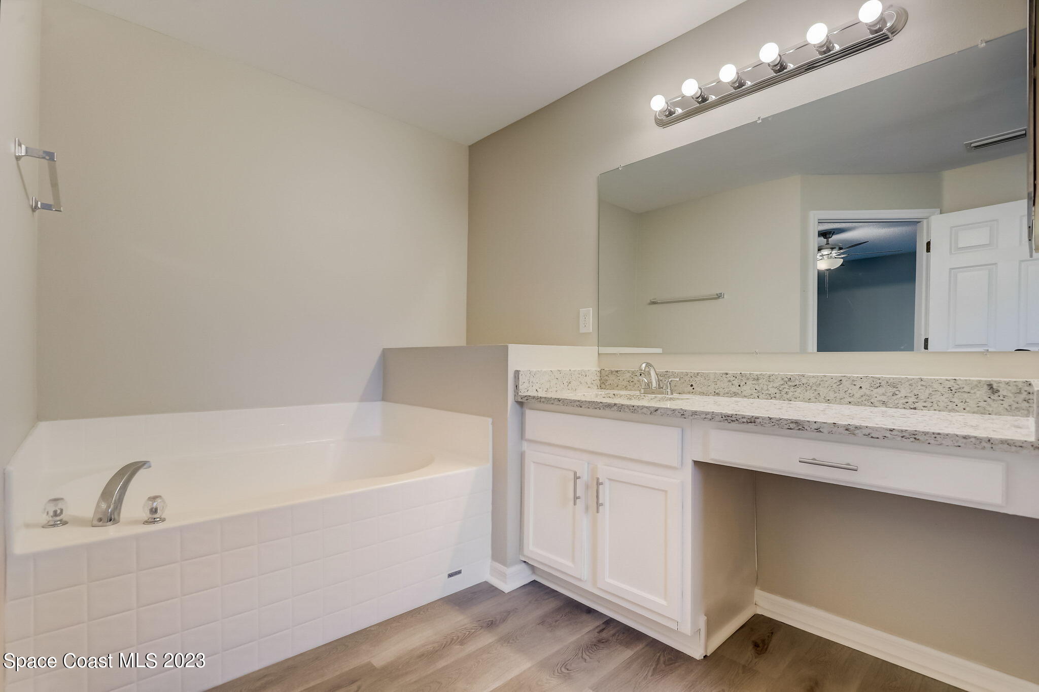 280 Gamewell Road Southwest Palm Bay, FL 32908 - Photo 16 of 19 a bathroom with a tub a sink and a mirror