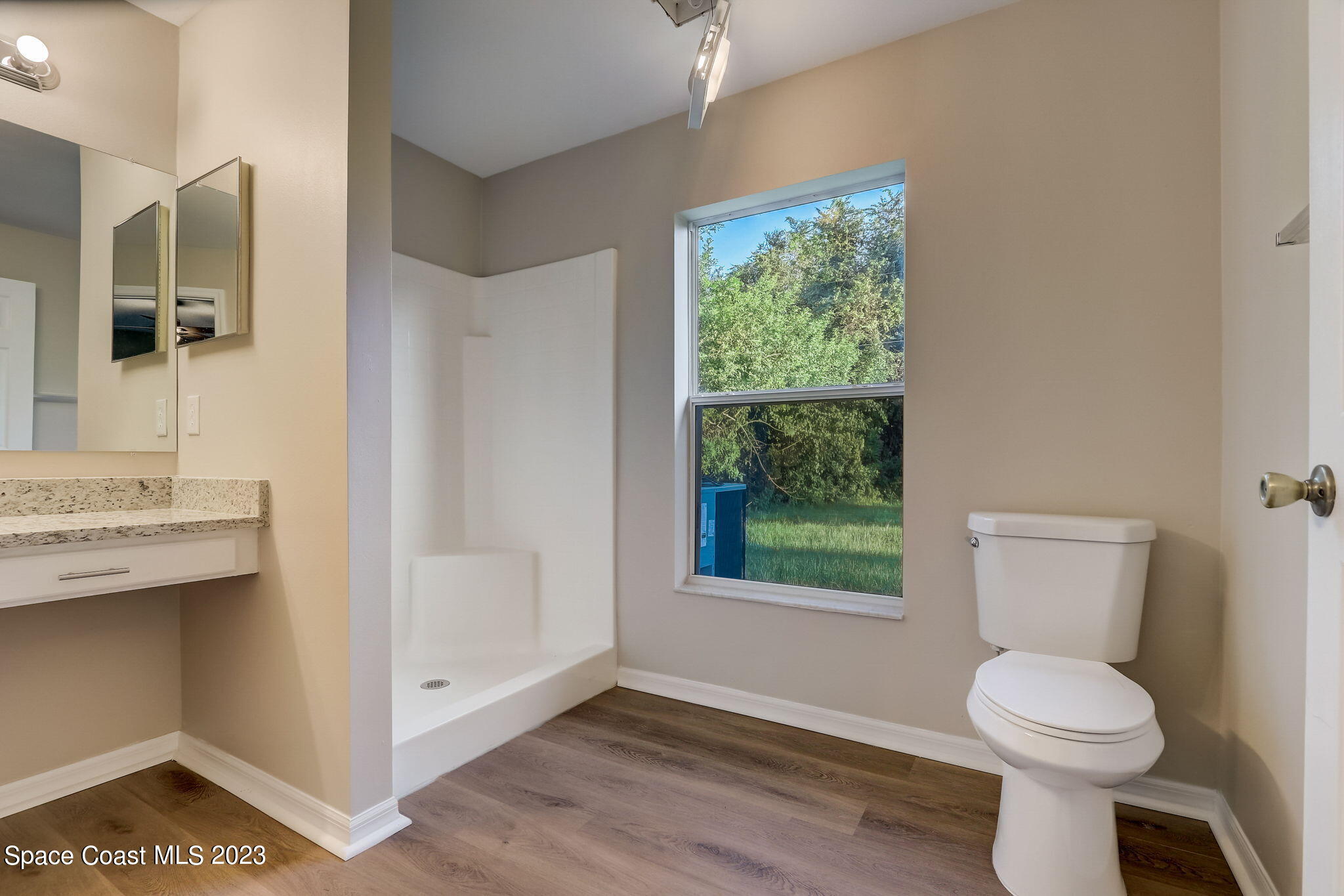280 Gamewell Road Southwest Palm Bay, FL 32908 - Photo 17 of 19 a bathroom with a sink a toilet and window