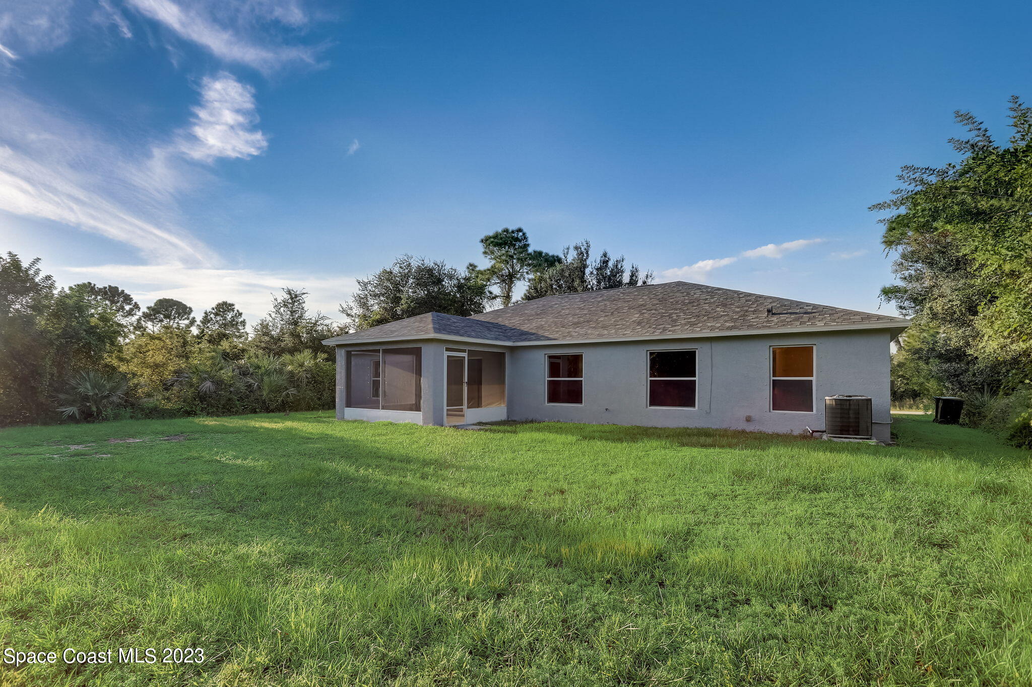 280 Gamewell Road Southwest Palm Bay, FL 32908 - Photo 19 of 19 a front view of a house with a garden