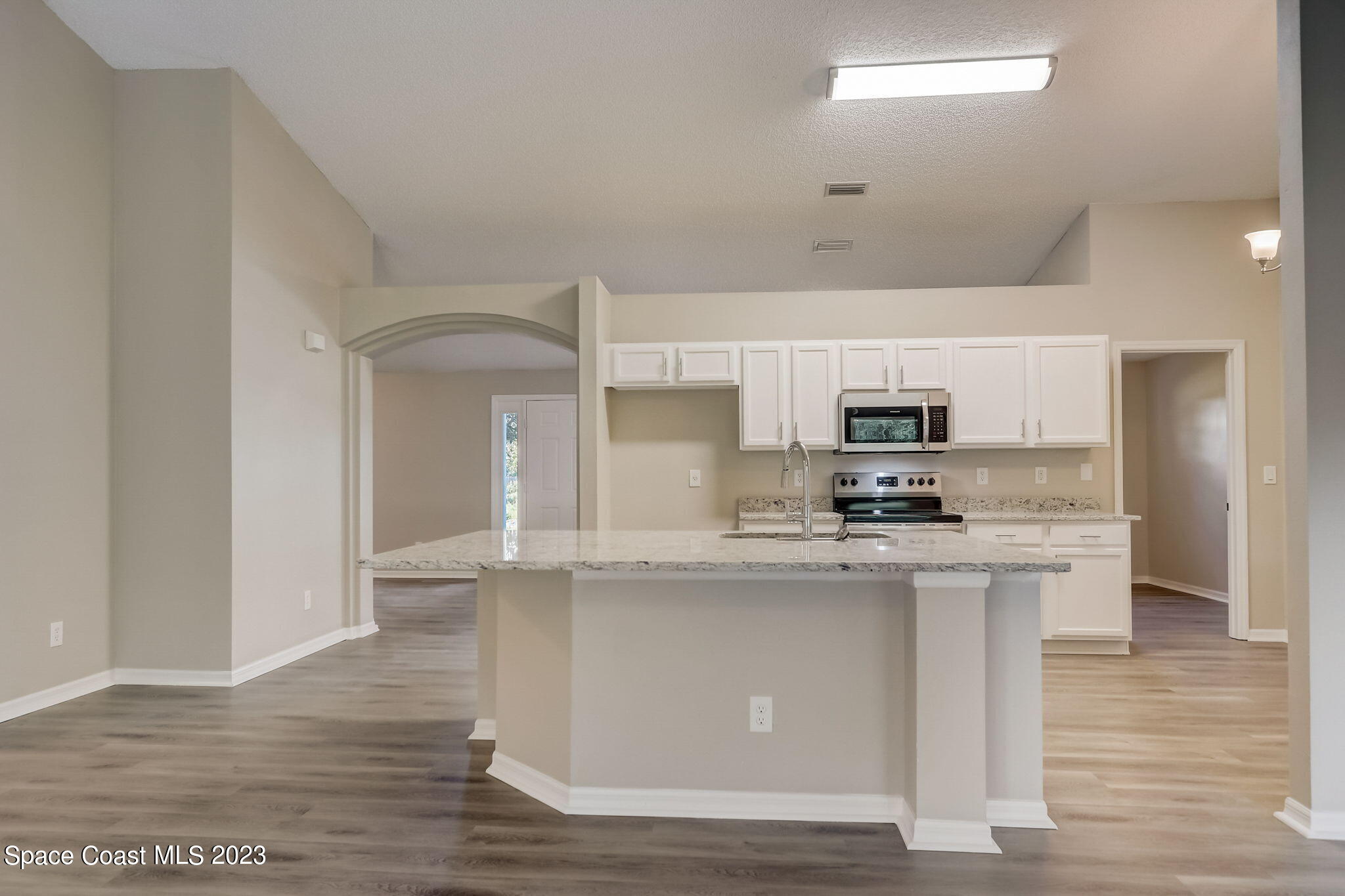 280 Gamewell Road Southwest Palm Bay, FL 32908 - Photo 6 of 19 a kitchen with stainless steel appliances granite countertop a sink a stove and cabinets