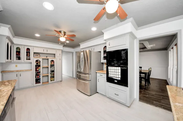 a view of a kitchen with furniture and a kitchen