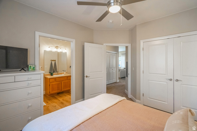 700 North Main Street, Unit F3 Washington, UT 84780 - Photo 17 of 34 Interior room featuring neutral wall tones, a ceiling fan with integrated lighting, and white bi-fold closet doors