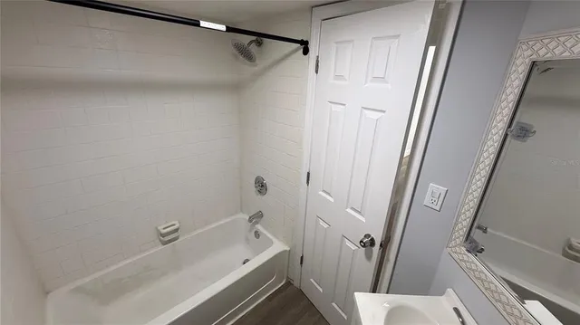 a bathroom with a sink a toilet and a shower