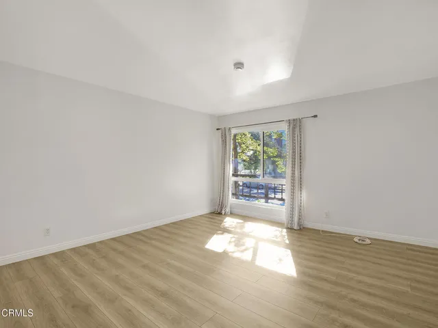 a view of a balcony with wooden floor