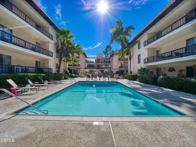 a pathway of a house with a yard