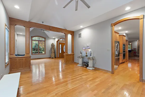 a kitchen with stainless steel appliances granite countertop a stove a sink and a refrigerator