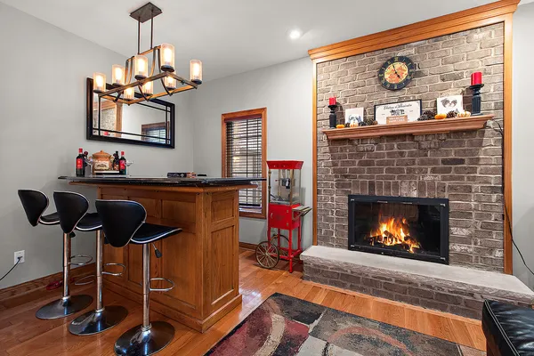 a kitchen with stainless steel appliances granite countertop a sink a stove and a microwave