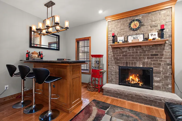 a kitchen with stainless steel appliances granite countertop a sink a stove and a microwave