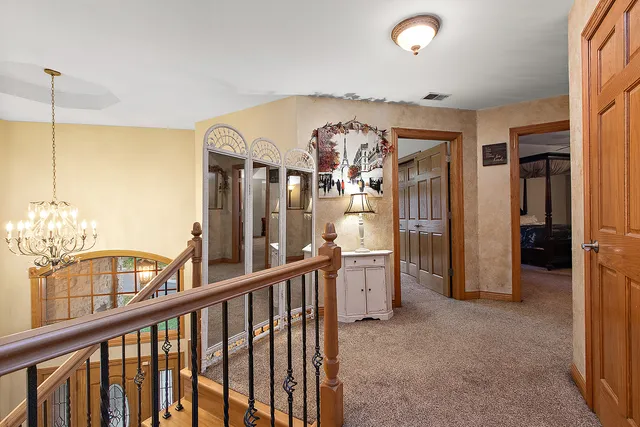 an empty room with fan and windows