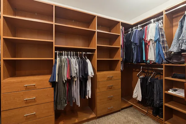 a view of a kitchen with furniture and wooden floor