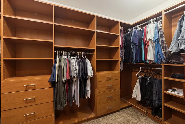 a view of a kitchen with furniture and wooden floor