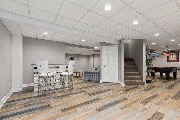 a view of a livingroom with an empty space and a ceiling fan