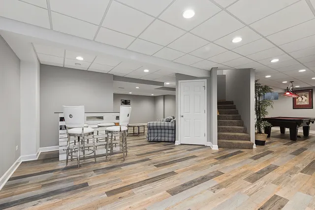 a view of a livingroom with an empty space and a ceiling fan