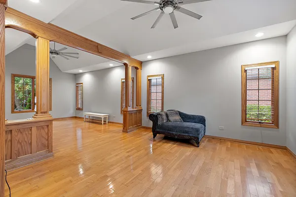 a view of a livingroom with furniture and floor to ceiling window