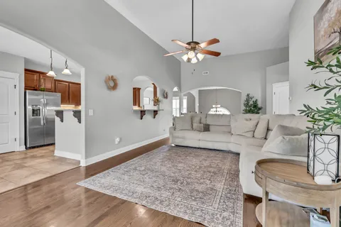 a view of kitchen with stainless steel appliances granite countertop cabinets and refrigerator