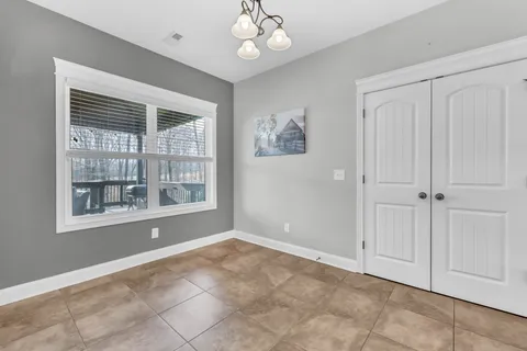 a large kitchen with granite countertop a sink a counter space and stainless steel appliances