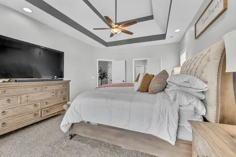 a view of an empty room and a ceiling fan