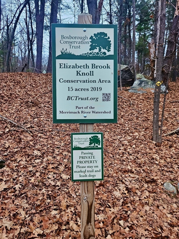 220 Swanson Road, Unit 606 Boxborough, MA 01719 - Photo 10 of 11 a sign board with parking space