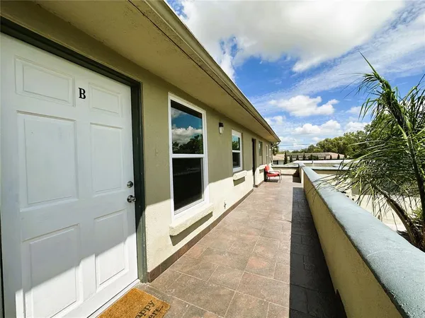 a view of swimming pool with seating space