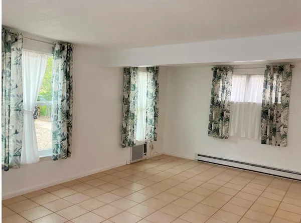 a view of a room with window and stairs