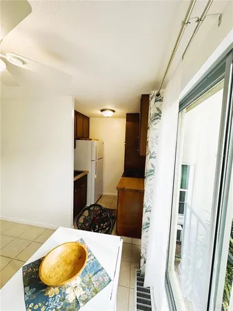 a kitchen with a refrigerator and a sink