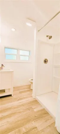 front view of house with potted plants