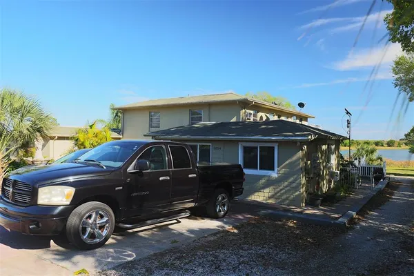 a view of front door and small plants