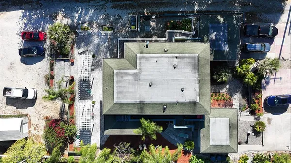 an aerial view of residential houses with outdoor space