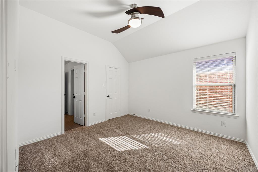 3040 Dunverny The Colony, TX 75056 - Photo 17 of 40 a view of a room with a ceiling fan and carpet