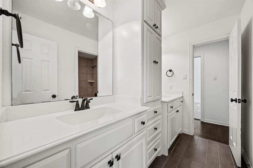 3040 Dunverny The Colony, TX 75056 - Photo 18 of 40 a bathroom with double vanity sink and mirror