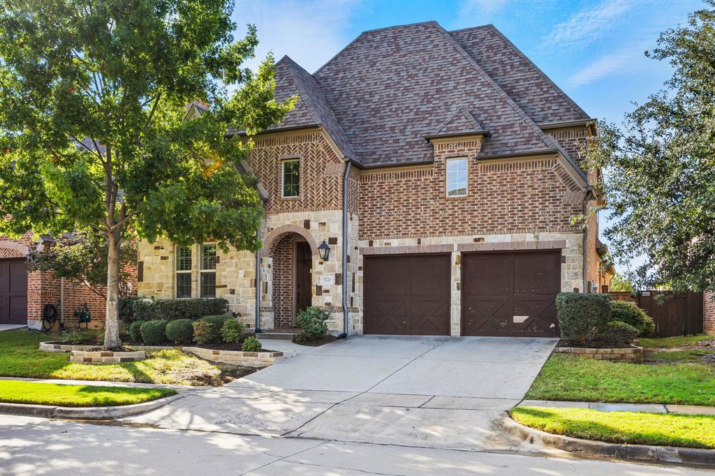 3040 Dunverny The Colony, TX 75056 - Photo 2 of 40 a front view of a house with a yard table and chairs