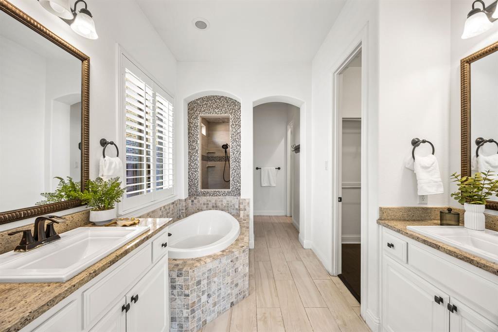 3040 Dunverny The Colony, TX 75056 - Photo 29 of 40 a bathroom with a granite countertop sink mirror and vanity