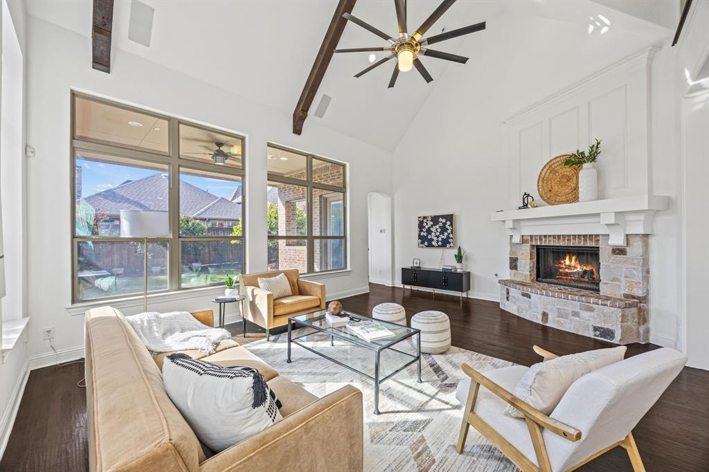 3040 Dunverny The Colony, TX 75056 - Photo 9 of 40 a living room with fireplace furniture and a floor to ceiling window
