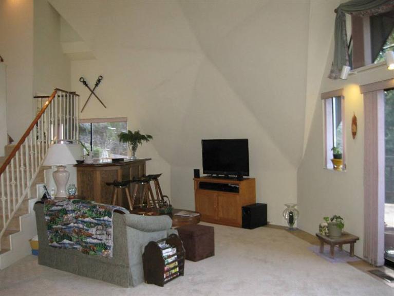 2363 Old Ferry Road Shady Cove, OR 97539 - Photo 4 of 31 a view of a livingroom with furniture and a flat screen tv