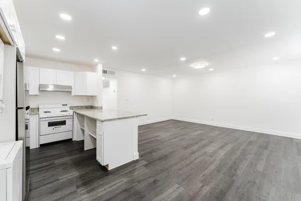 a view of kitchen with wooden floor