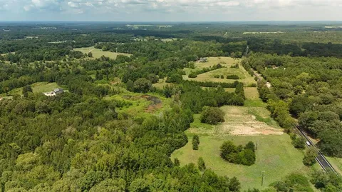 a view of a lake with green space