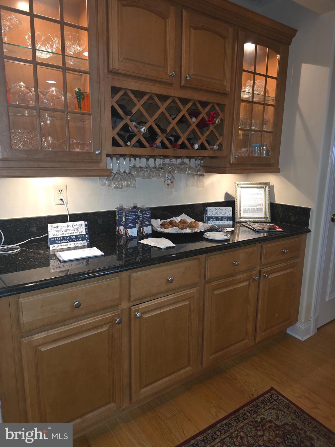 2102 Points Reach, Unit 2102 Berlin, MD 21811 - Photo 11 of 36 a kitchen with stainless steel appliances granite countertop a sink stove and cabinets