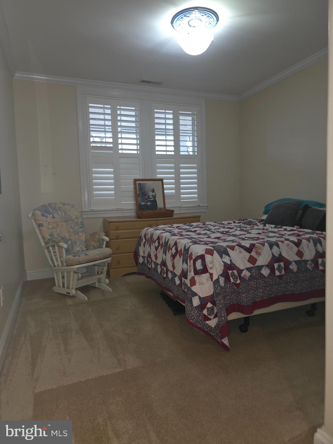 2102 Points Reach, Unit 2102 Berlin, MD 21811 - Photo 24 of 36 a bedroom with a bed chair and window