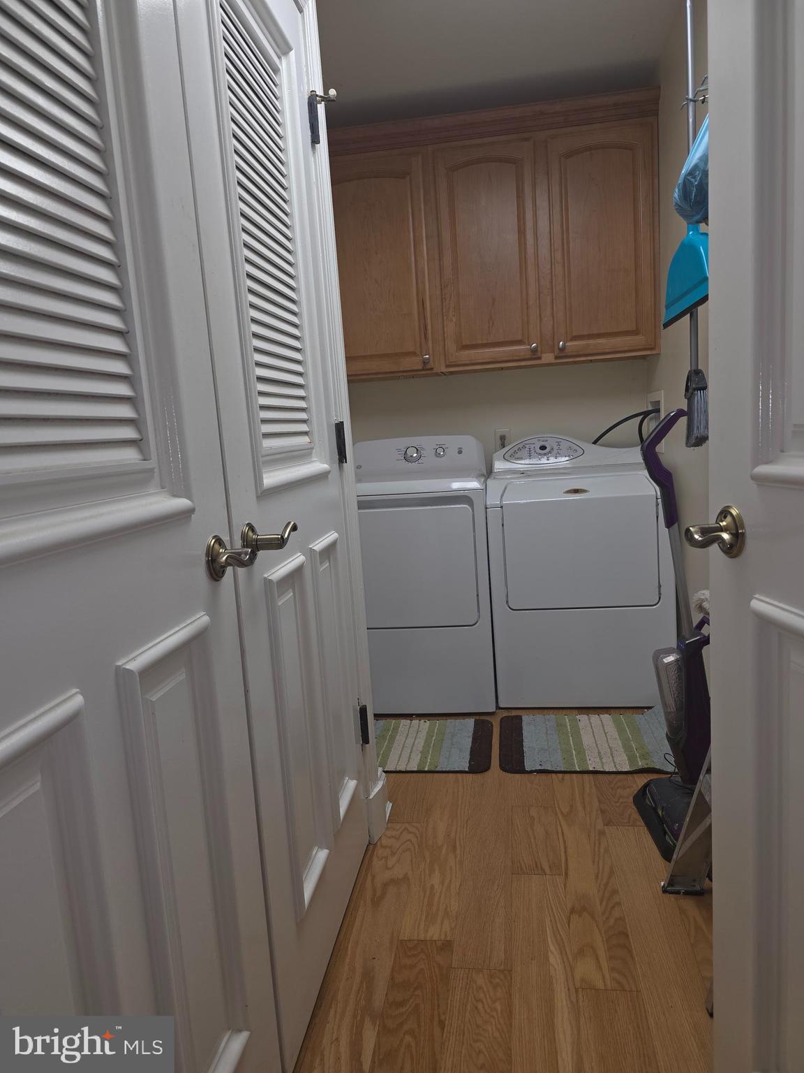 2102 Points Reach, Unit 2102 Berlin, MD 21811 - Photo 28 of 36 a utility room with dryer and washer