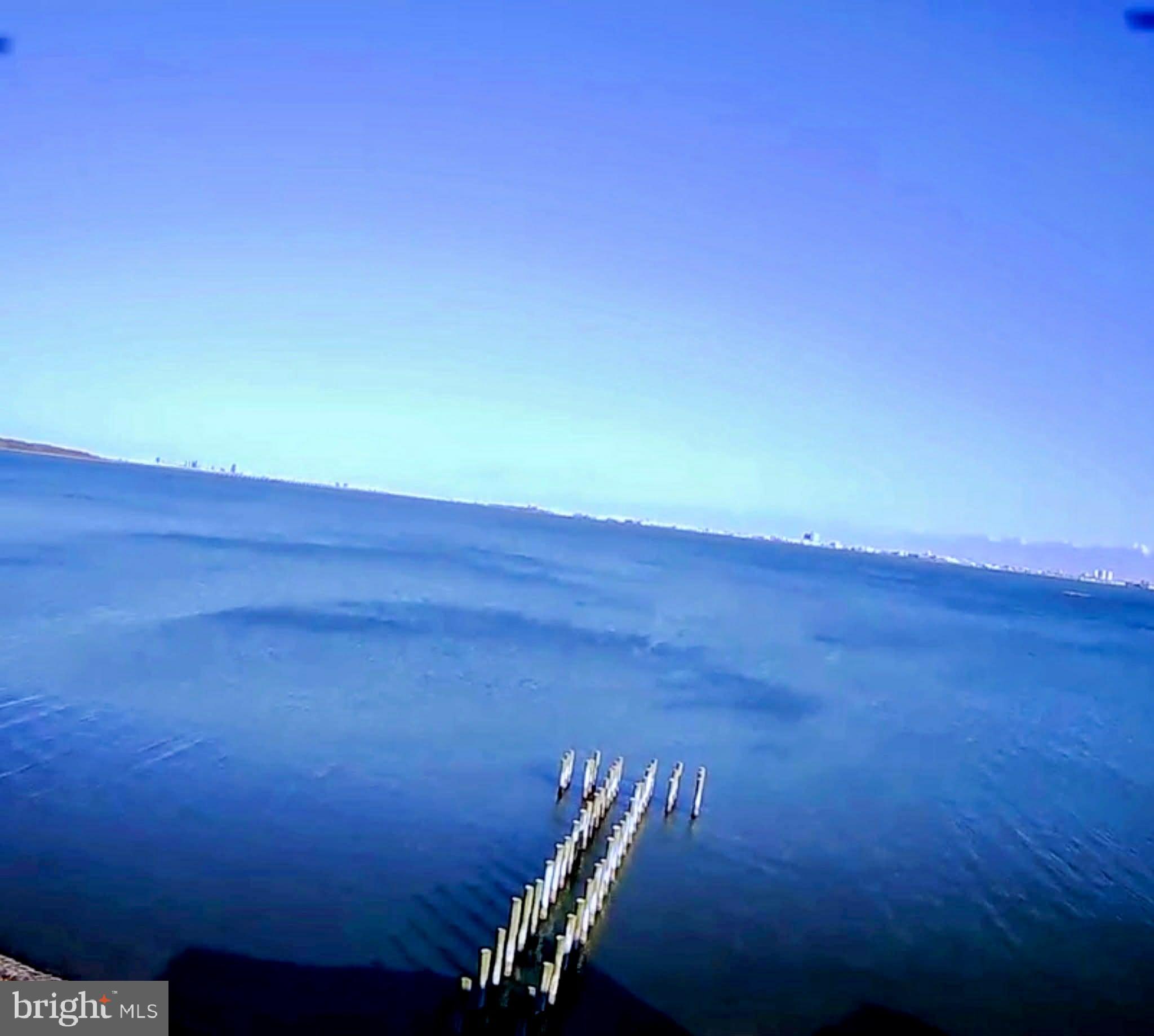 2102 Points Reach, Unit 2102 Berlin, MD 21811 - Photo 4 of 36 a view of a room with wooden floor and windows