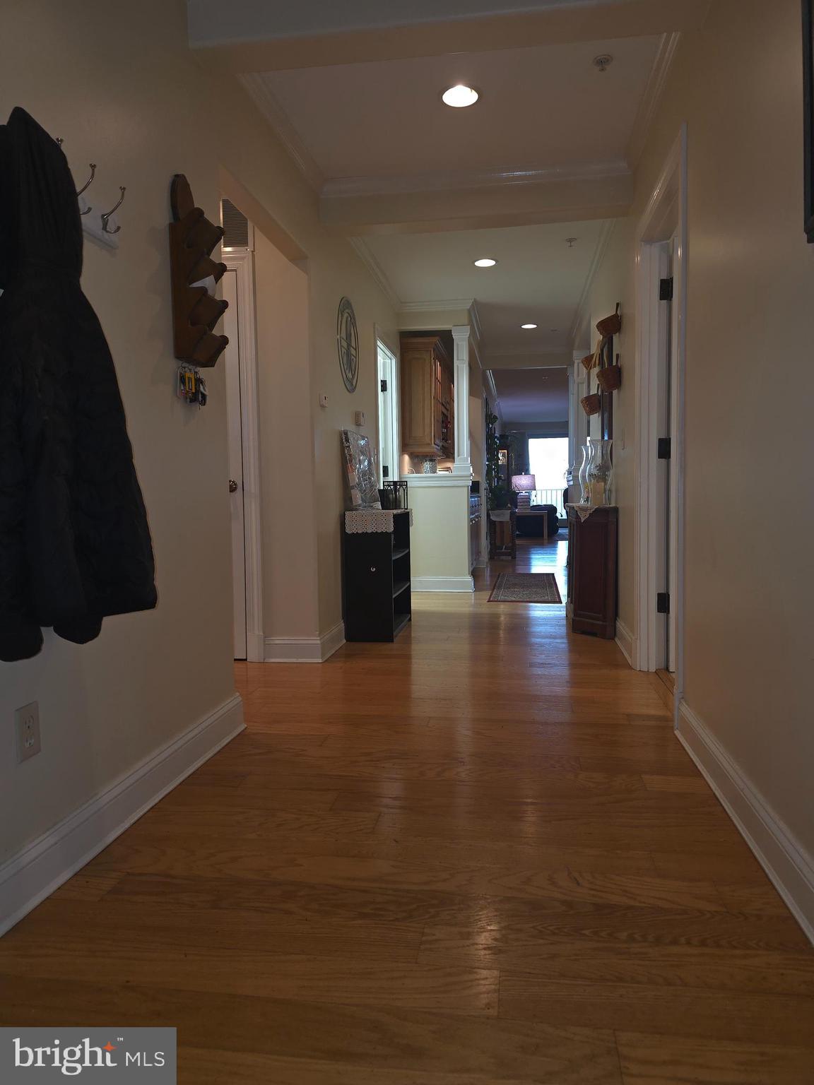 2102 Points Reach, Unit 2102 Berlin, MD 21811 - Photo 7 of 36 a living room with furniture and a wooden floor