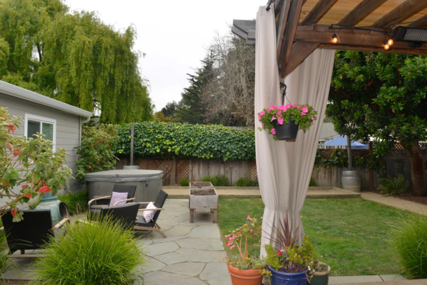 3308 Sycamore Place Carmel, CA 93923 - Photo 3 of 14 a front view of a house with garden and plants