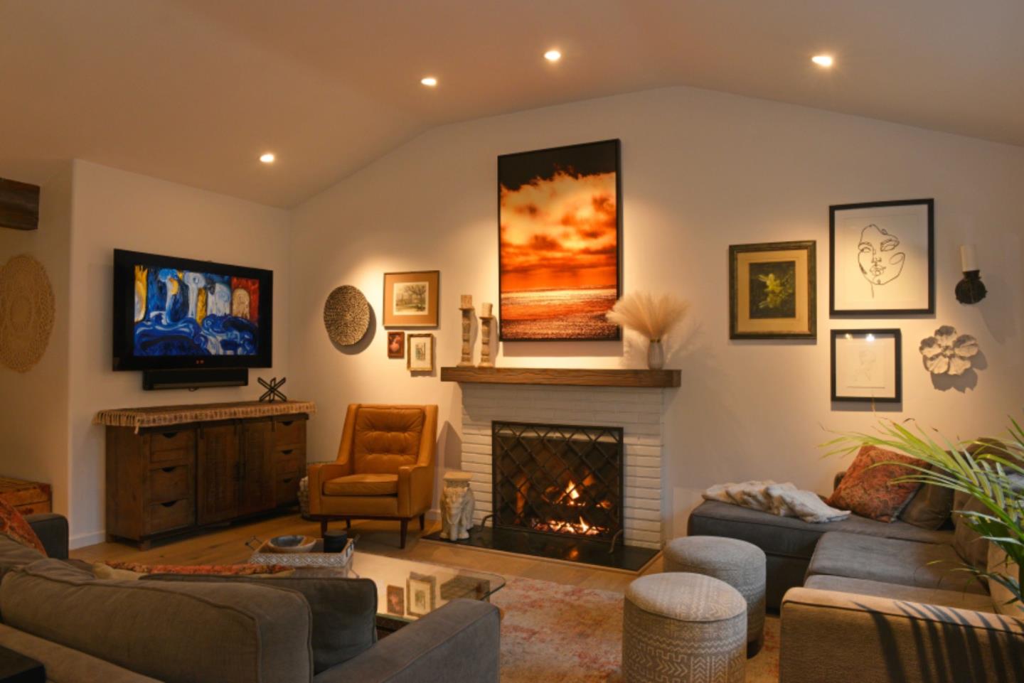 3308 Sycamore Place Carmel, CA 93923 - Photo 5 of 14 a living room with furniture a flat screen tv and a fireplace
